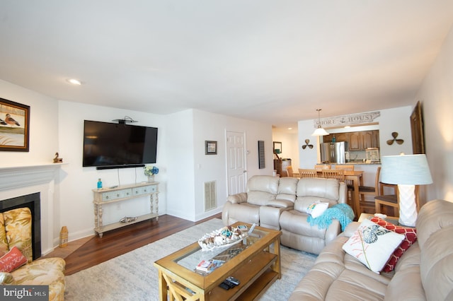 101 Main St Unit 115, Secretary, MD 21664 - living area with wood finished floors, a fireplace, and recessed lighting