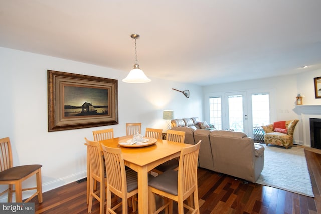 101 Main St Unit 115, Secretary, MD 21664 - dining area featuring dark wood-type flooring and a fireplace