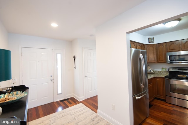 101 Main St Unit 115, Secretary, MD 21664 - foyer featuring dark wood finished floors and recessed lighting