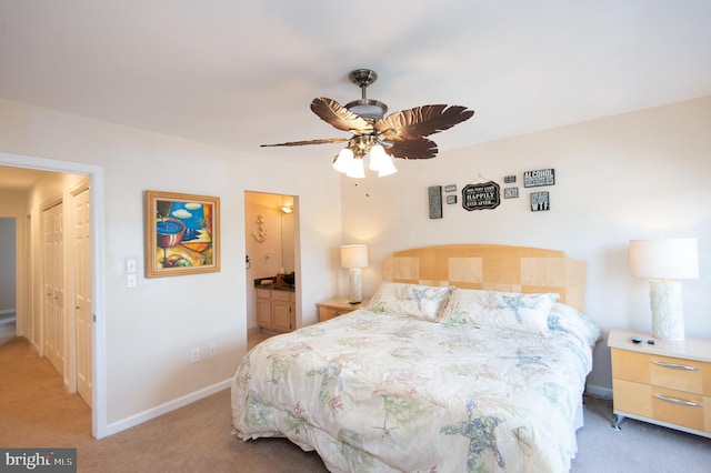 101 Main St Unit 115, Secretary, MD 21664 - bedroom with light carpet, ceiling fan, and connected bathroom