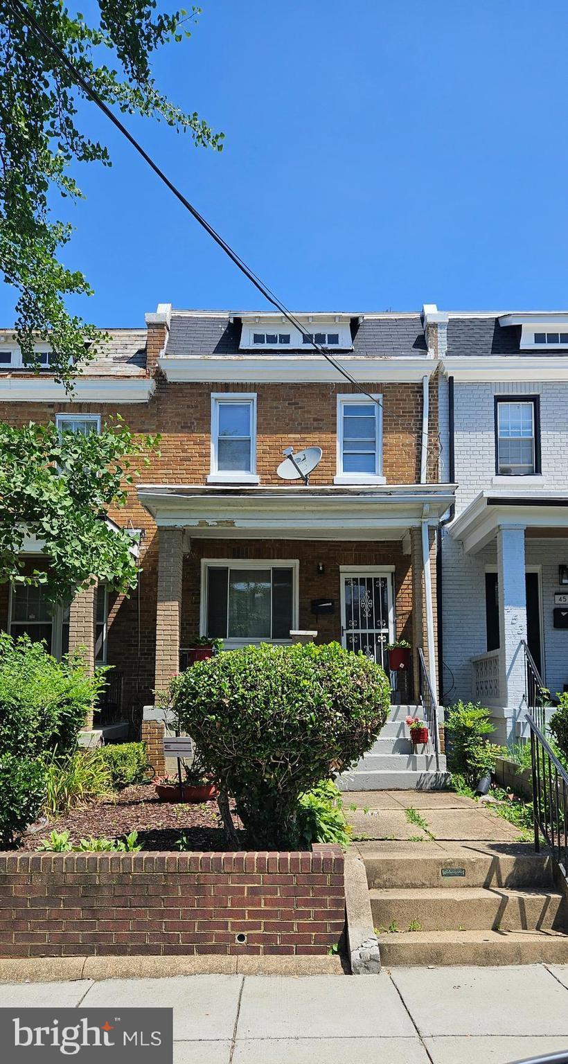 455 Delafield Pl NW, Washington, DC 20011 - townhome / multi-family property with brick siding and mansard roof