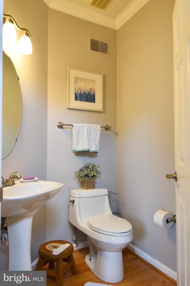 3166 Freestone Ct, Abingdon, MD 21009 - half bath with ornamental molding and wood finished floors