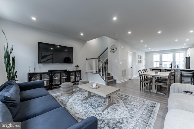 7282 Nittany Ln, Alexandria, VA 22306 - living room featuring stairway, recessed lighting, and light wood finished floors