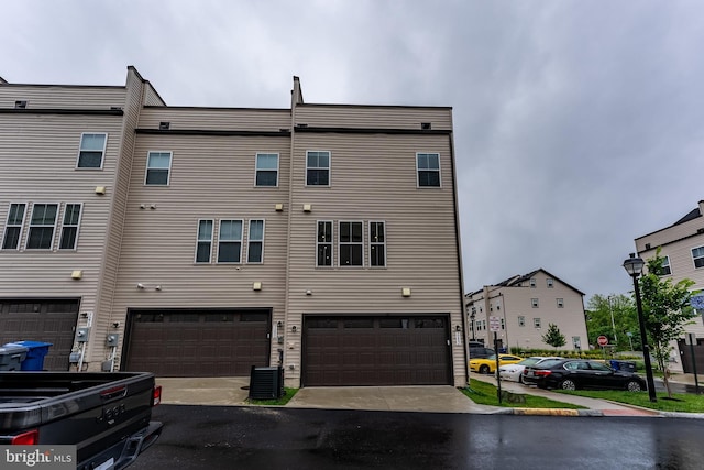 7282 Nittany Ln, Alexandria, VA 22306 - back of house with an attached garage and driveway