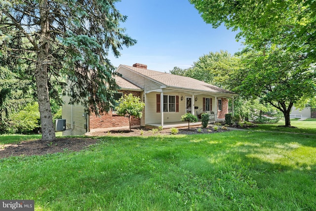 136 Main St, Red Hill, PA 18076 - ranch-style house featuring a porch, brick siding, a front yard, and a chimney