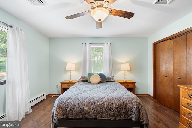 136 Main St, Red Hill, PA 18076 - bedroom with dark wood-type flooring, baseboard heating, a closet, and ceiling fan