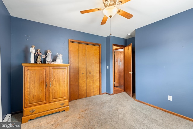 136 Main St, Red Hill, PA 18076 - unfurnished bedroom with a baseboard radiator, carpet flooring, a closet, and a ceiling fan