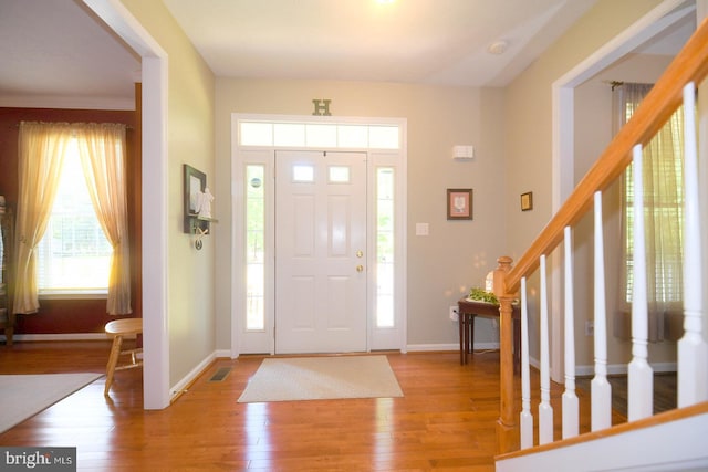 21481 Indian Bridge Rd, California, MD 20619 - entryway with stairway and light wood-style flooring