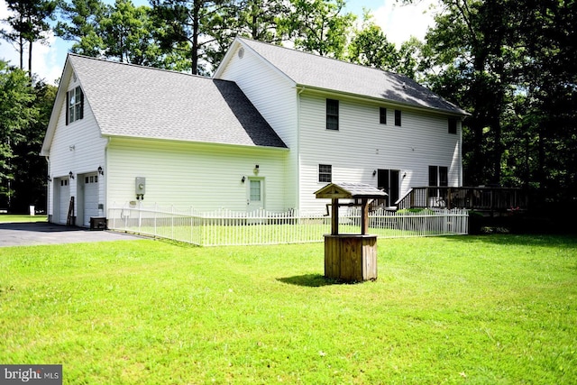21481 Indian Bridge Rd, California, MD 20619 - back of house featuring an attached garage, roof with shingles, driveway, and a deck