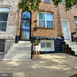 3 W 24th St W, Baltimore, MD 21218 - property entrance with brick siding