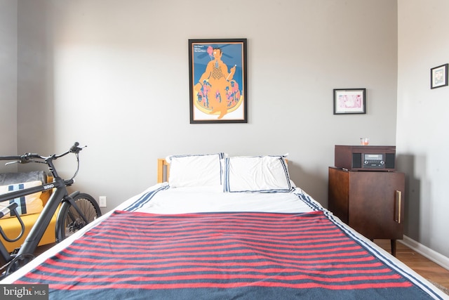 3 W 24th St W, Baltimore, MD 21218 - bedroom featuring wood finished floors and baseboards