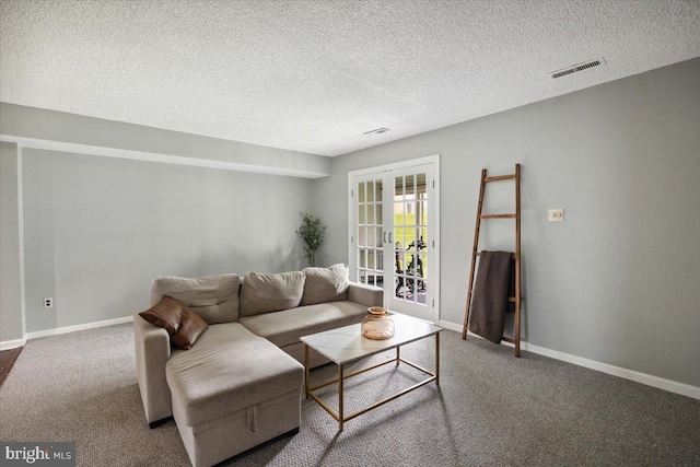 29 Twin Brooks Dr, Willow Grove, PA 19090 - carpeted living room featuring a textured ceiling and french doors