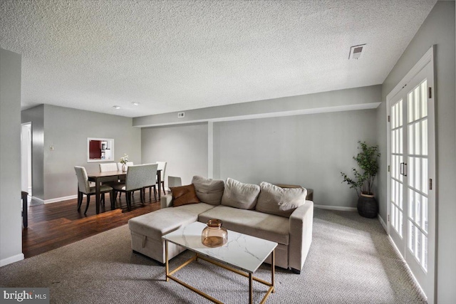 29 Twin Brooks Dr, Willow Grove, PA 19090 - living room with a textured ceiling, carpet, and wood finished floors