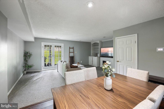 29 Twin Brooks Dr, Willow Grove, PA 19090 - carpeted dining room with a textured ceiling, french doors, and built in shelves