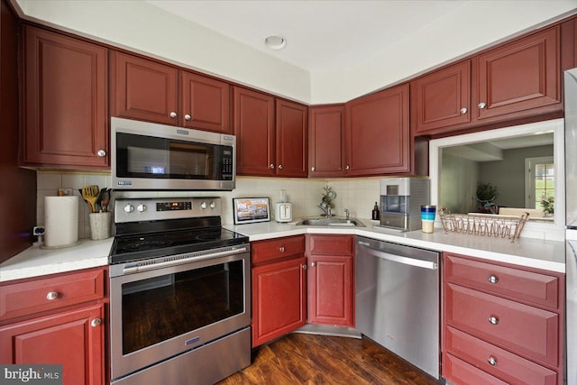 29 Twin Brooks Dr, Willow Grove, PA 19090 - kitchen with stainless steel appliances, light countertops, reddish brown cabinets, and backsplash