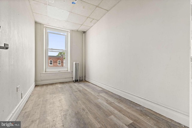 1327 W Chew St, Allentown, PA 18104 - unfurnished room with a drop ceiling, wood finished floors, and radiator