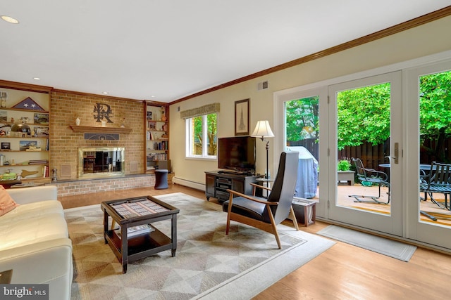 500 S Lexington St, Arlington, VA 22204 - living room with ornamental molding, a baseboard radiator, light wood-style flooring, a fireplace, and recessed lighting