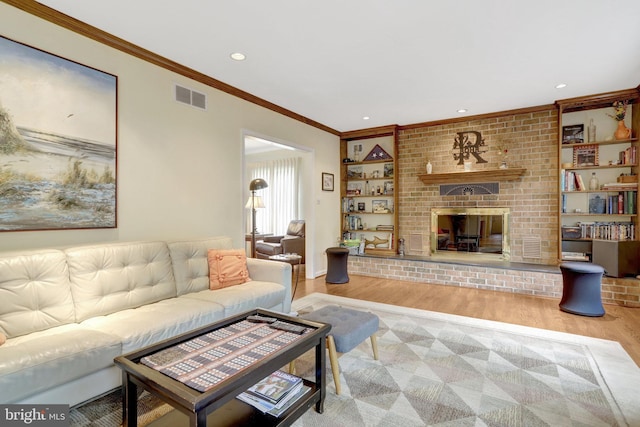 500 S Lexington St, Arlington, VA 22204 - living room featuring wood finished floors, crown molding, a brick fireplace, and recessed lighting