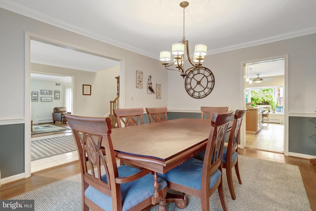 500 S Lexington St, Arlington, VA 22204 - dining room with light wood-type flooring, a chandelier, ornamental molding, and a baseboard heating unit