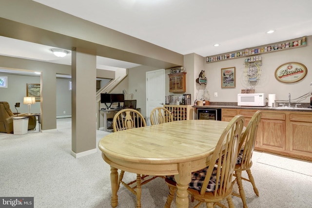 500 S Lexington St, Arlington, VA 22204 - dining room with bar with sink, beverage cooler, light colored carpet, a baseboard radiator, and recessed lighting