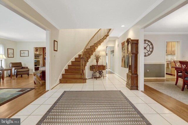 500 S Lexington St, Arlington, VA 22204 - entryway with light tile patterned floors, stairway, and crown molding