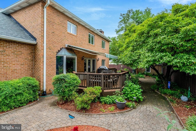 500 S Lexington St, Arlington, VA 22204 - back of property featuring a deck, brick siding, and a chimney