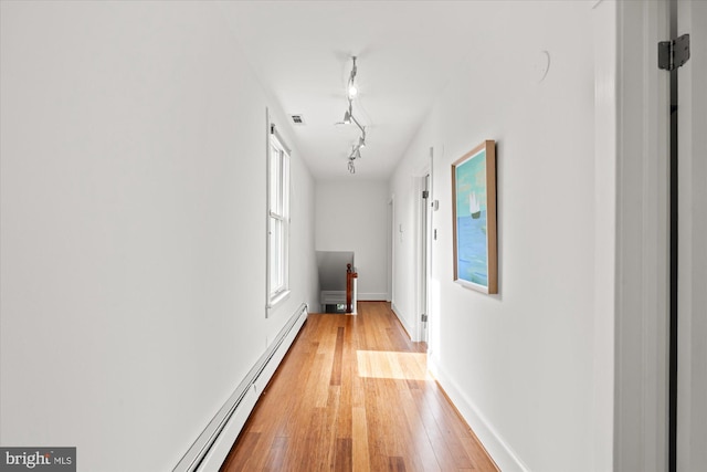411 E Bellefonte Ave, Alexandria, VA 22301 - corridor with baseboard heating, light wood-type flooring, and track lighting
