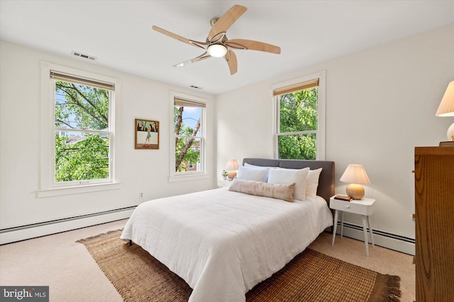 411 E Bellefonte Ave, Alexandria, VA 22301 - carpeted bedroom featuring a baseboard radiator and a ceiling fan
