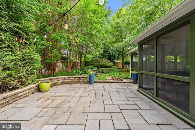 411 E Bellefonte Ave, Alexandria, VA 22301 - fenced backyard featuring a patio and a sunroom