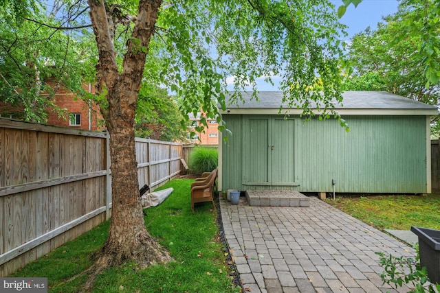 411 E Bellefonte Ave, Alexandria, VA 22301 - fenced backyard with a storage shed and a patio