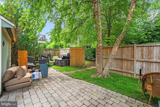 411 E Bellefonte Ave, Alexandria, VA 22301 - fenced backyard featuring a patio area