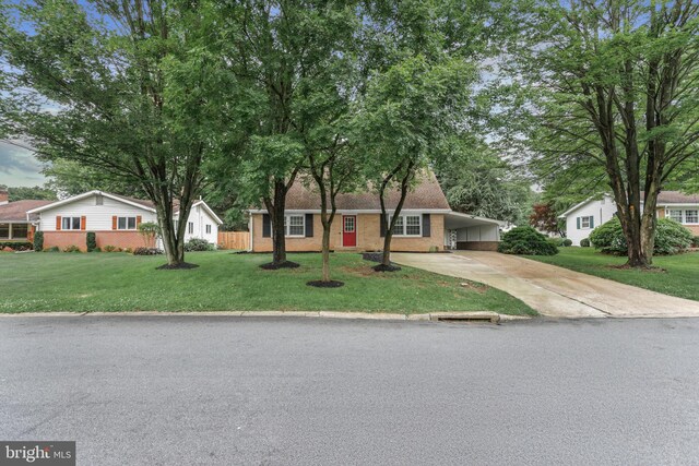 708 S Broad St, Mechanicsburg, PA 17055 - ranch-style home with concrete driveway, brick siding, a carport, and a front lawn