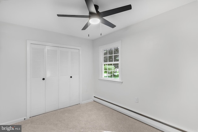 708 S Broad St, Mechanicsburg, PA 17055 - unfurnished bedroom with baseboard heating, carpet floors, a closet, and a ceiling fan