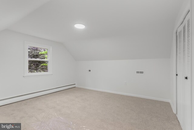 708 S Broad St, Mechanicsburg, PA 17055 - additional living space featuring a baseboard heating unit, vaulted ceiling, and carpet floors