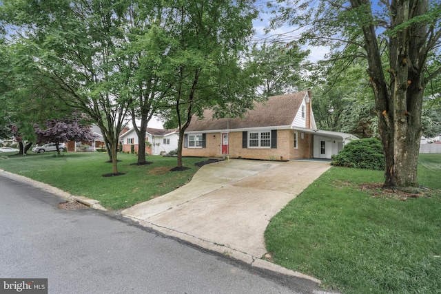 708 S Broad St, Mechanicsburg, PA 17055 - view of front of home featuring concrete driveway, brick siding, and a front yard
