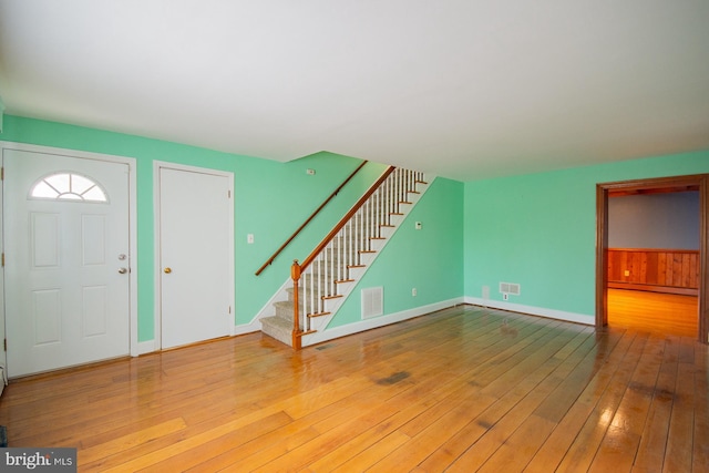 121 E James St, Winchester, VA 22601 - entrance foyer with stairway, wood-type flooring, and a baseboard radiator