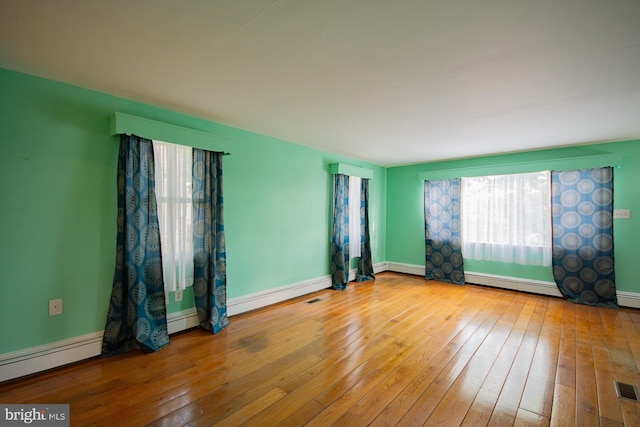 121 E James St, Winchester, VA 22601 - spare room featuring a baseboard radiator and hardwood / wood-style flooring