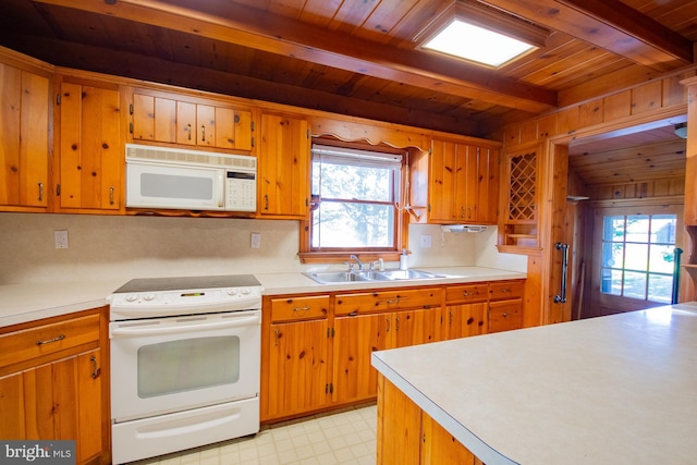 121 E James St, Winchester, VA 22601 - kitchen featuring white appliances, a wood ceiling with exposed beams, light countertops, plenty of natural light, and light floors