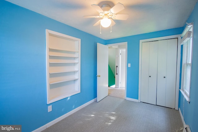 121 E James St, Winchester, VA 22601 - unfurnished bedroom featuring carpet floors, baseboard heating, a closet, and ceiling fan