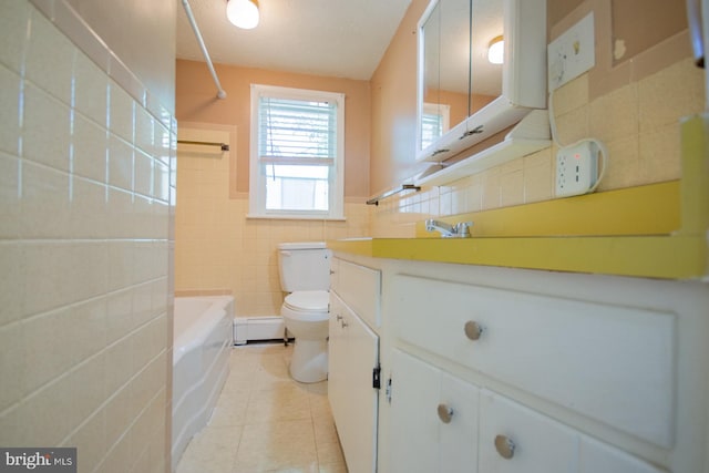 121 E James St, Winchester, VA 22601 - full bath featuring tile walls, tile patterned flooring, vanity, a baseboard radiator, and washtub / shower combination