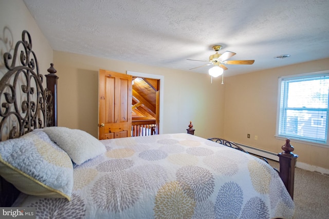 121 E James St, Winchester, VA 22601 - carpeted bedroom featuring a ceiling fan, baseboard heating, and a textured ceiling