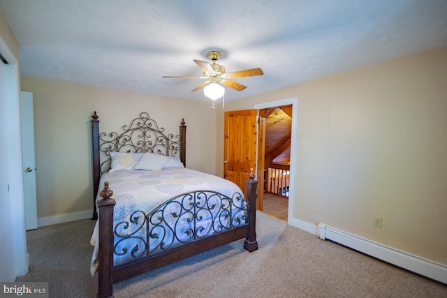 121 E James St, Winchester, VA 22601 - bedroom featuring baseboard heating, carpet flooring, and a ceiling fan