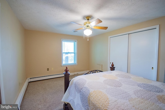 121 E James St, Winchester, VA 22601 - bedroom with a baseboard radiator, carpet flooring, a closet, a ceiling fan, and a textured ceiling