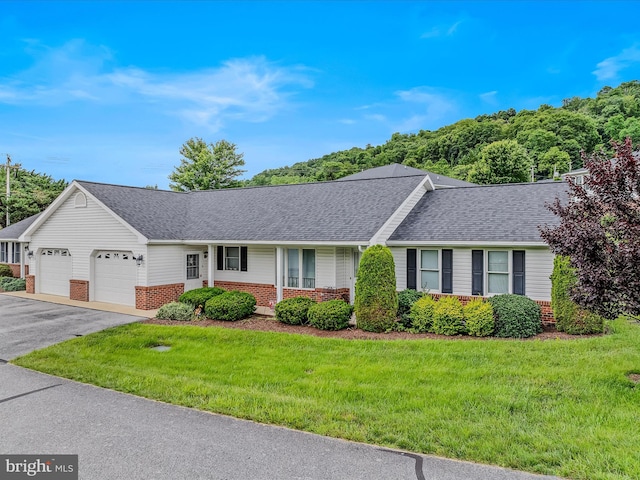 23 Garden Dr, Berkeley Springs, WV 25411 - single story home featuring brick siding, a garage, a shingled roof, and a front yard