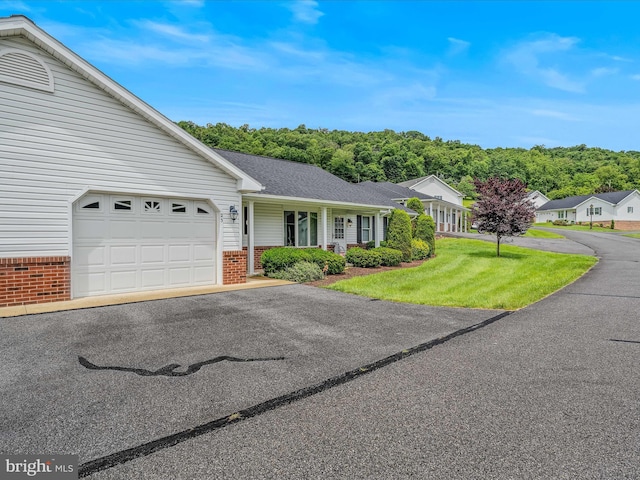 23 Garden Dr, Berkeley Springs, WV 25411 - ranch-style house with brick siding, an attached garage, driveway, a front lawn, and roof with shingles
