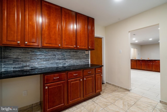 1363 Byberry Rd, Huntingdon Valley, PA 19006 - kitchen featuring tasteful backsplash, light tile patterned floors, recessed lighting, dark brown cabinets, and dark stone countertops