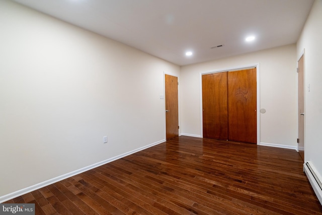 1363 Byberry Rd, Huntingdon Valley, PA 19006 - unfurnished bedroom featuring a baseboard heating unit, dark wood-type flooring, a closet, and recessed lighting