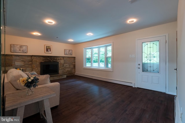 1363 Byberry Rd, Huntingdon Valley, PA 19006 - living area with baseboard heating, a baseboard heating unit, dark wood-style floors, a stone fireplace, and recessed lighting