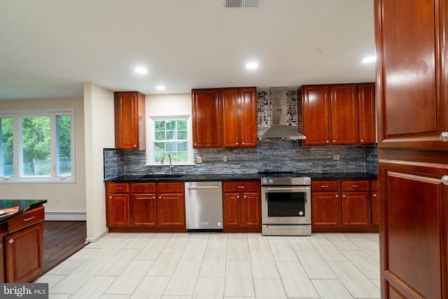 1363 Byberry Rd, Huntingdon Valley, PA 19006 - kitchen featuring stainless steel appliances, wall chimney range hood, a baseboard heating unit, backsplash, and recessed lighting