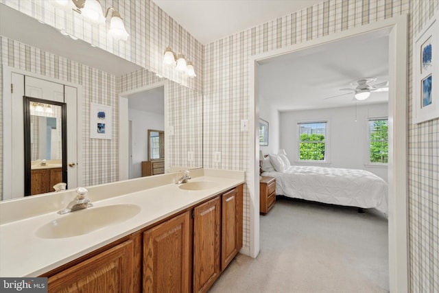 1305 Halifax Ct Unit 1305, West Chester, PA 19382 - ensuite bathroom with wallpapered walls, double vanity, and ceiling fan
